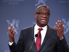 Nobel Peace Prize laureate Dr. Denis Mukwege speaks to the media during a news conference with Norwegian Prime Minister Erna Solberg, in Oslo, Tuesday Dec. 11, 2018.