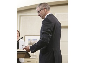 Travis Toews, President of Treasury Board and Minister of Finance is sworn into office, in Edmonton on Tuesday April 30, 2019. The Alberta government has served notice it is bringing in legislation to override collective bargaining agreements for thousands of public sector workers in order to delay wage talks.