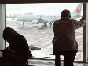 A self-described American evangelist was arrested with another woman in St. John's last week for allegedly posting on Twitter a false bomb threat about the St. John's International Airport and defamatory statements. Passengers wait for their delayed flights to take off from the airport in St. John's on Sunday, Dec. 30, 2007.