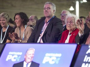 Dean French, centre, chief of staff for Doug Ford, listens to the Ontario Premier speak at the Ontario PC Convention in Toronto, on Friday November 16, 2018. Ontario Premier Doug Ford's chief of staff has resigned. In a statement, Ford says Dean French will be returning to the private sector.