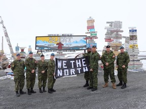 Canadian Armed Forces members hold up a banner in support of the Toronto Raptors at the Canadian Forces Station in Alert, Nunavut in a handout photo. THE CANADIAN PRESS/HO-Canadian Armed Forces MANDATORY CREDIT
