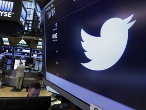 The Twitter logo appears at the post where it trades, on the floor of the New York Stock Exchange, Friday, June 17, 2016. Twitter will create a registry of all online political ads posted on its platform during this fall's federal election campaign.