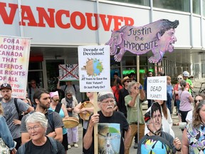 Protesters take part in a pipeline expansion demonstration in downtown Vancouver on Tuesday June 18, 2019. A British Columbia First Nation is promising a legal challenge of the federal government's decision to approve the Trans Mountain pipeline expansion, while the premier says his government will continue to defend the province's coast.