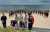 Prime Minister Justin Trudeau and French Prime Minister Edouard Philippe lay wreaths during a ceremony on Juno Beach as part of D-Day 75th anniversary commemorations in Normandy, France, on June 6, 2019.