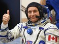 David Saint-Jacques of the Canadian Space Agency, a member of the International Space Station (ISS) expedition 58/59, gestures as his space suit is tested prior to the launch onboard the Soyuz MS-11 spacecraft at the Russian-leased Baikonur cosmodrome in Kazakhstan on December 3, 2018.