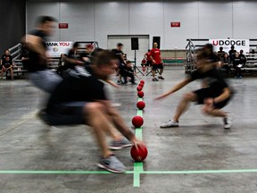 Players rush to the middle to grab dodgeballs during the sixth annual UDodge dodgeball tournament at the Edmonton Expo Centre on April 1, 2015.