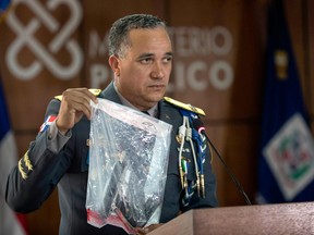 The Dominican Republic's director of the national police, Ney Aldrin Bautista Almonte, shows on June 12, 2019,  in Santo Domingo, the weapon used in the attack against former baseball player David Ortiz.