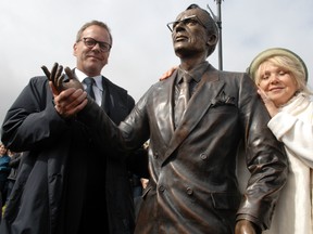 Canadian actor, Kiefer Sutherland (L) grandson of former Saskatchewan premier Tommy Douglas with world-renowned sculptor Lea Vivot (R) beside a statue of Douglas by Vivot in Weyburn on September 10, 2010.