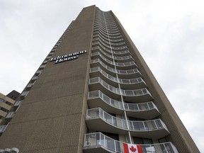 A flag is attached to the balcony of Edmonton House on Wednesday, June 26, 2019 in Edmonton. (Greg Southam-Postmedia)
