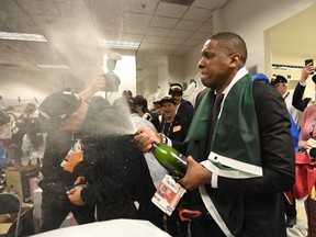 Toronto Raptors President Masai Ujiri celebrates defeating the Golden State Warriors and winning the Larry O'Brien NBA Championship Trophy after Game 6 basketball action in Oakland, Calif. on Thursday, June 13, 2019. Raptors have won their first NBA title in franchise history.