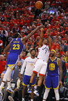 Toronto Raptor Kyle Lowry attempts a last-second shot during Game Five of the 2019 NBA Finals against the Golden State Warriors.