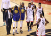 Toronto Raptor Kyle Lowry motions for the crowd not to cheer as Kevin Durant of the Golden State Warriors leaves the court with an injury during Game Five of the 2019 NBA Finals.