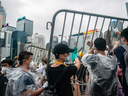 Protesters move barricades to block the street near the government headquarters during a rally against the extradition bill on June 12, 2019 in Hong Kong, China.