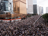 Protesters march along a road during a demonstration against a proposed extradition bill in Hong Kong, China June 12, 2019.