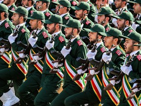 In a file photo taken in Tehran on Sept. 22, 2018, members of Iran's Revolutionary Guards Corps (IRGC) march during an annual military parade marking the anniversary of the 1980-1988 war with Saddam Hussein's Iraq.