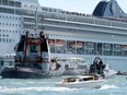 The cruise ship MSC Opera loses control and crashes against a smaller tourist boat at the San Basilio dock in Venice, Italy June 2, 2019.