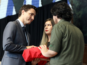 Prime Minister Justin Trudeau is presented with the final report during the closing ceremony of the National Inquiry into Missing and Murdered Indigenous Women and Girls in Gatineau, Quebec, June 3, 2019.