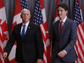 Prime Minister Justin Trudeau and U.S. Vice-President Mike Pence leave following a news conference in Ottawa on May 30, 2019.