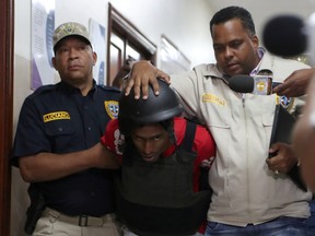 The suspects in the case of baseball legend David Ortiz's shooting are escorted out of the court in Santo Domingo, Dominican Republic June 14, 2019.