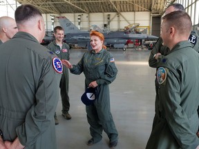 U.S. Ambassador to Poland Georgette Mosbacher talks to American pilots at the Polish military air base in Krzesiny, near Poznan