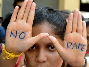 In this photograph taken on September 13, 2013 Indian students of Saint Joseph Degree college participate in an anti-rape protest in Hyderabad. Six men have been convicted in the rape and murder of an eight-year-old girl, whose death has sparked tensions between Indian Hindus and Muslims.