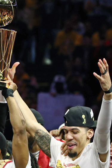 The Toronto Raptors celebrate with the Larry O'Brien Championship Trophy. (Ezra Shaw/Getty Images)