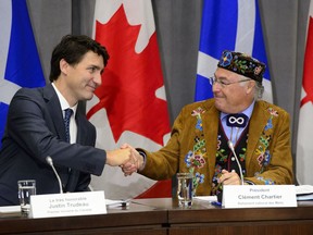 Prime Minister Justin Trudeau shakes hands with Metis National Council president Clement Chartier at the annual Crown-Metis Nation Summit in Ottawa on Thursday, June 13, 2019.