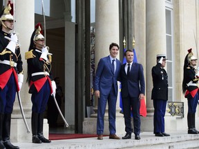 Prime Minister Justin Trudeau meets with French President Emmanuel Macron at the Elysee Palace in Paris on Friday, June 7, 2019.