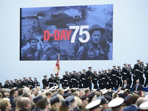 Soldiers march on stage during the D-Day 75th Anniversary British International Commemorative Event at Southsea Common in Portsmouth, England on Wednesday, June 5, 2019.