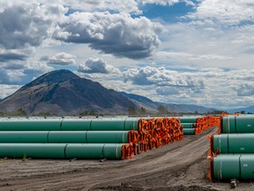 Steel pipe to be used in the construction of the Trans Mountain pipeline expansion lies at a stockpile site in Kamloops, B.C., on June 18, 2019.