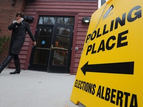 Voters leave the polling station at Christ Church in Elbow Park in SW, Calgary, Alta, on Monday October 27, 2014.