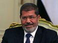 Egypt's President Mohamed Mursi participates in a meeting with U.S. Defense Secretary Leon Panetta at the presidential palace in Cairo July 31, 2012.