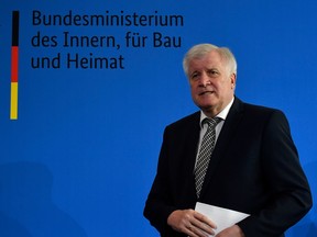 German Interior Minister Horst Seehofer at a press conference given to comment on the assassination-style murder of a pro-migrant city official on June 18, 2019 in Berlin. - German prosecutors had said before they suspect a far-right motive in the night-time killing of Walter Luebcke, 65, with a close-range gun shot to the head, which would make it "a political assassination".