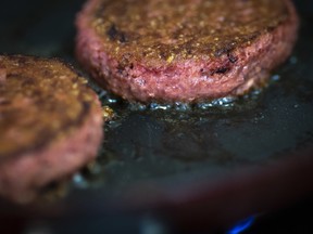 In this photo illustration, two patties of Beyond Meat "The Beyond Burger" cook in a skillet, June 13, 2019 in the Brooklyn borough of New York City. Since going public in early May, Beyond Meat's stock has soared more than 450 per cent and its market value is over $8 billion USD.