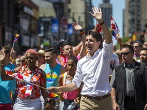 Canadian Prime Minister Justin Trudeau waves to spectators at the Pride parade in downtown Toronto, Ont. on Sunday June 23, 2019.