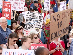 Teachers, along with other union groups including the Ontario Federation of Labour (OFL), rally outside the Ottawa court house on Elgin St as part of a province wide Day of Action.