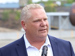 Ontario Premier Doug Ford answers questions from reporters during a visit to Lopes Ltd. in Coniston, Ont. on Wednesday June 19, 2019. John Lappa/Sudbury Star/Postmedia Network ORG XMIT: POS1906191553054099