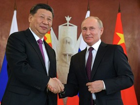 Chinese President Xi Jinping and his Russian counterpart, Vladimir Putin, shake hands after talks at the Kremlin in Moscow on June 5, 2019.