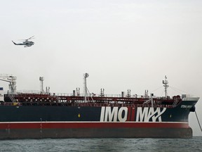 A picture taken on July 21, 2019, shows Iranian Revolutionary Guards patrolling around the British-flagged tanker Stena Impero as it's anchored off the Iranian port city of Bandar Abbas.