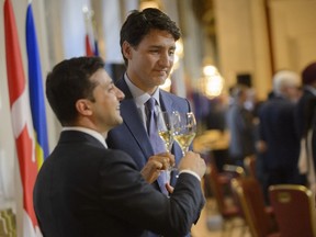 Canadian Prime Minister Justin Trudeau and Ukrainian President Volodymyr Zelenskiy toast before a dinner during the Ukraine Reform Conference in Toronto, on Tuesday, July 2, 2019.
