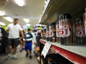 Customers shop at a convenience store named the Area 51 Alien Center located along U.S. highway 95 on July 21, 2019 in Amargosa Valley, Nevada.