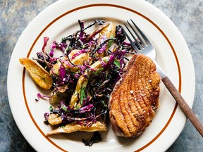 Seared duck breast with brown sugar–vinegar cabbage, roasted potatoes and herb salad