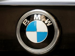 A BMW logo is seen on a vehicle in downtown Toronto on Friday, July 26, 2019. The German automaker is suing Autoport Ltd. for $175 million for alleged weather-related damage to 2,966 BMW and MINI vehicles in Halifax.