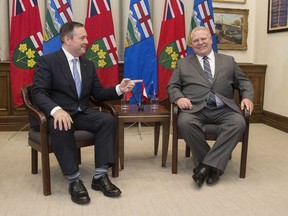 Ontario Premier Doug Ford, right, poses with Alberta Premier Jason Kenney at the Ontario Legislature in Toronto on Friday,May 3, 2019. Kenney will host the premiers of Ontario, Saskatchewan, New Brunswick and the Northwest Territories at the Calgary Stampede.