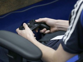 A student plays a video game in Sapulpa, Okla. on April 3, 2019. A spate of recent high-profile crimes allegedly perpetrated by young men with a passion for video games is prompting industry watchers to raise cautions against reading too much into their hobbies.