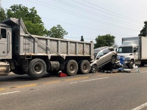 An accident is shown in Caledon, Ont. on Monday, July 8, 2019 in this handout photo. Provincial police say one woman has died after a dump truck, a semi and two cars collided in Caledon, Ont., on Monday.