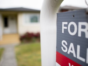 A real estate sign is pictured in Vancouver, B.C., Tuesday, June, 12, 2018. The Alberta Real Estate Association is providing its members with an emergency response app after a Realtor was sexually assaulted at an open house in Calgary last month.