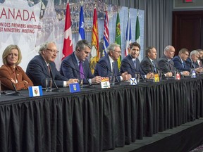 Canadian premiers and the Prime Minister speak to the media at the First Ministers closing news conference, Friday, December 7, 2018 in Montreal. They are from the left: Joe Savikataaq, Nunavut, Bob McLeod Northwest Territories, Rachel Notley, Alberta, Wade MacLauchlan, PEI, Stephen McNeil, Nova Scotia, Blaine Higgs, New Brunswick, Justin Trudeau, Canada, Francois Legault, Quebec, John Horgan, British Columbia, Scott Moe, Saskatchewan, Dwight Ball, Newfoundland and Sandy Silver, Yukon. Canada's 13 provincial and territorial leaders are descending on Saskatchewan this week to take part in the annual gathering of the country's premiers. Canada's 13 provincial and territorial leaders are in Saskatchewan this week, but for the first time in years, the annual gathering won't have women at the table.