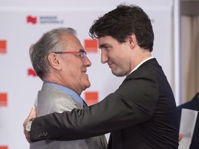 Prime Minister Justin Trudeau hugs Laurent McCutcheon after receiving the 2016 Laurent McCutcheon Award for his commitment to fighting homophobia and transphobia during a ceremony in Montreal, Monday, May 16, 2016.