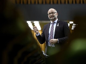 Minister of Justice and Attorney General of Canada David Lametti rises during a Committee of the Whole in the House of Commons on Parliament Hill in Ottawa on May 14, 2019. Federal Justice Minister David Lametti says the Ontario government's desire to obscure a share responsibility on legal aid as an "excuse for spending cuts" will leave many of the province's most vulnerable at greater risk and without appropriate protection.